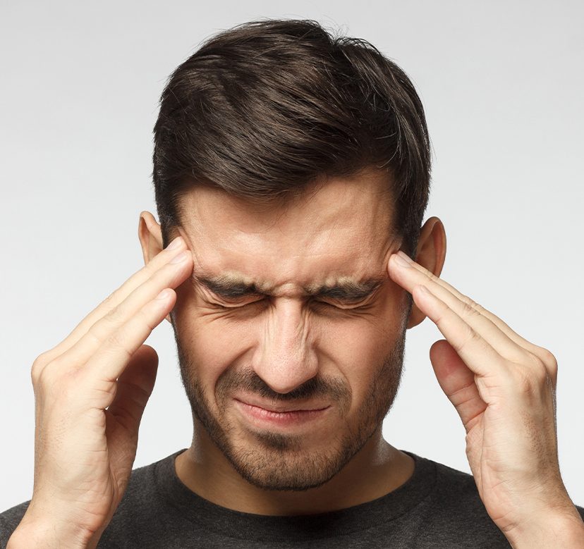 Man dealing with chronic headaches