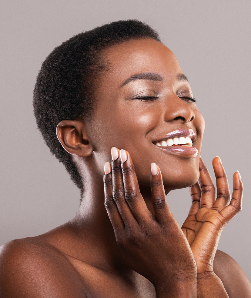 Happy woman touching the sides of her face